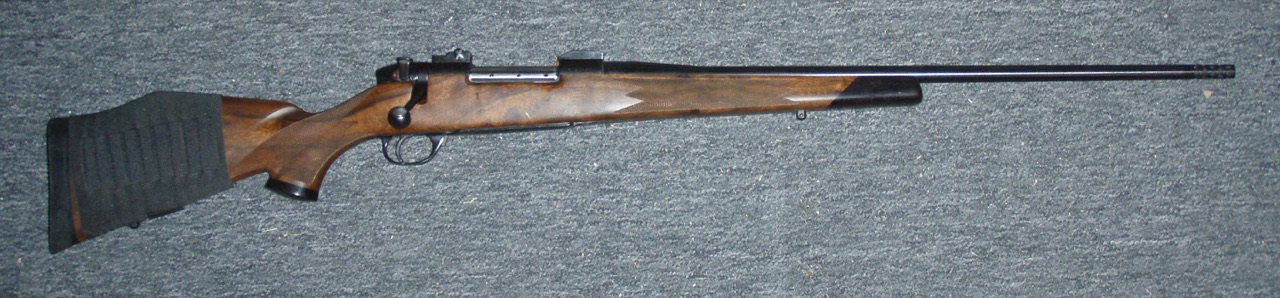 A sporting bolt-action rifle displayed without people